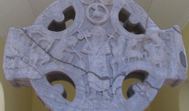 Durrow Cross, east side of head, two figures playing, David on the harp.