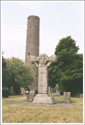 Kells, County Meath, Ireland, Unfinished cross with round tower in background